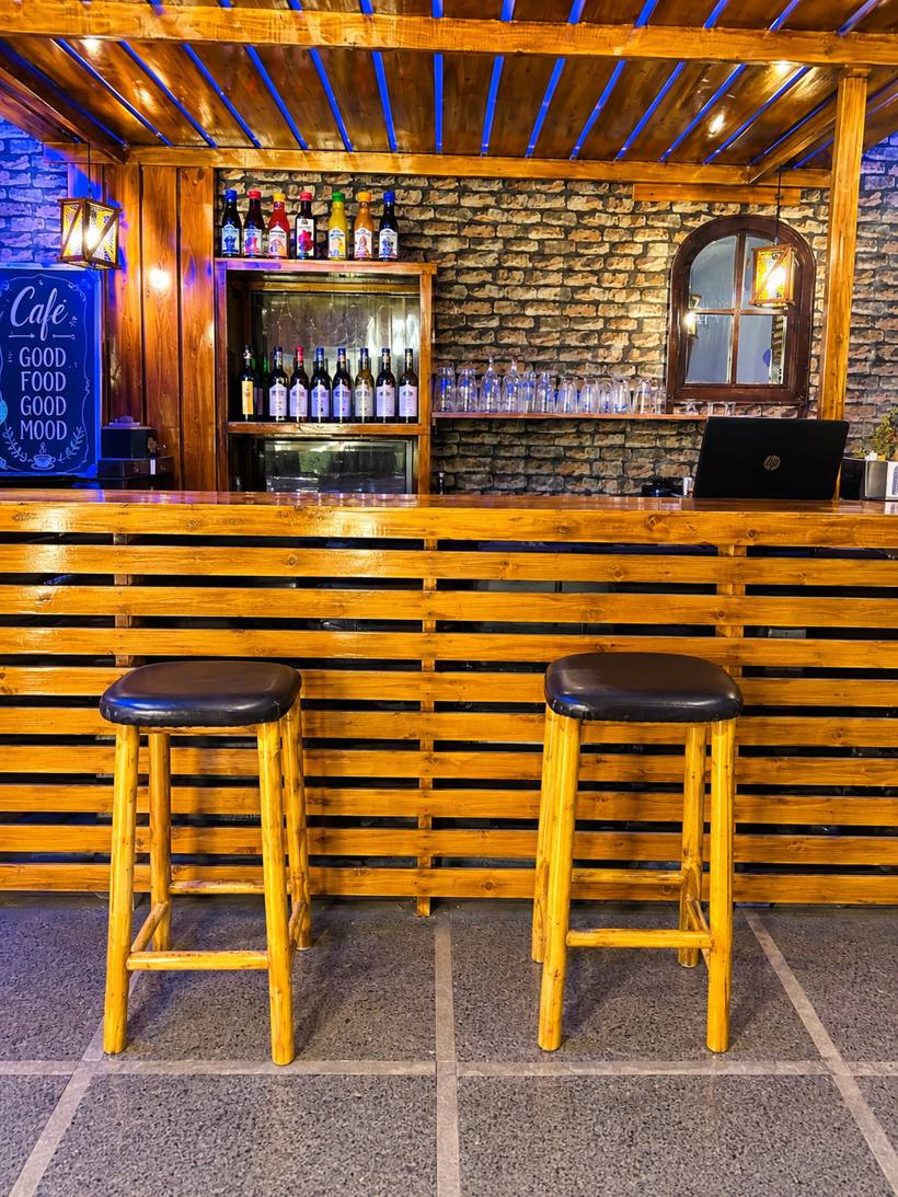 Wooden bar counter with stools